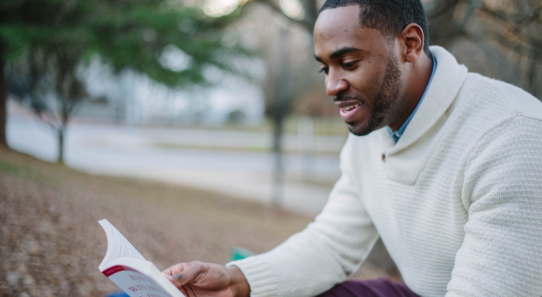 student reading book